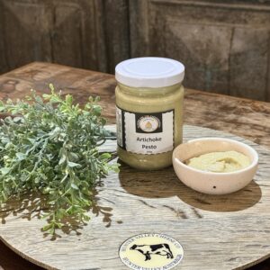 Jar of creamy artichoke pesto in jar & bowl, served as a gourmet accompaniment for cheeseboards, crackers and artisan entertaining