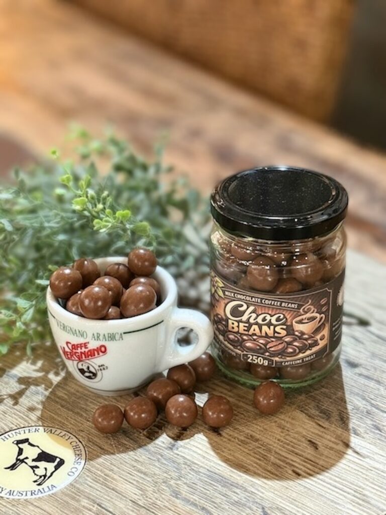 Milk chocolate coated coffee beans in a gourmet confectionary package